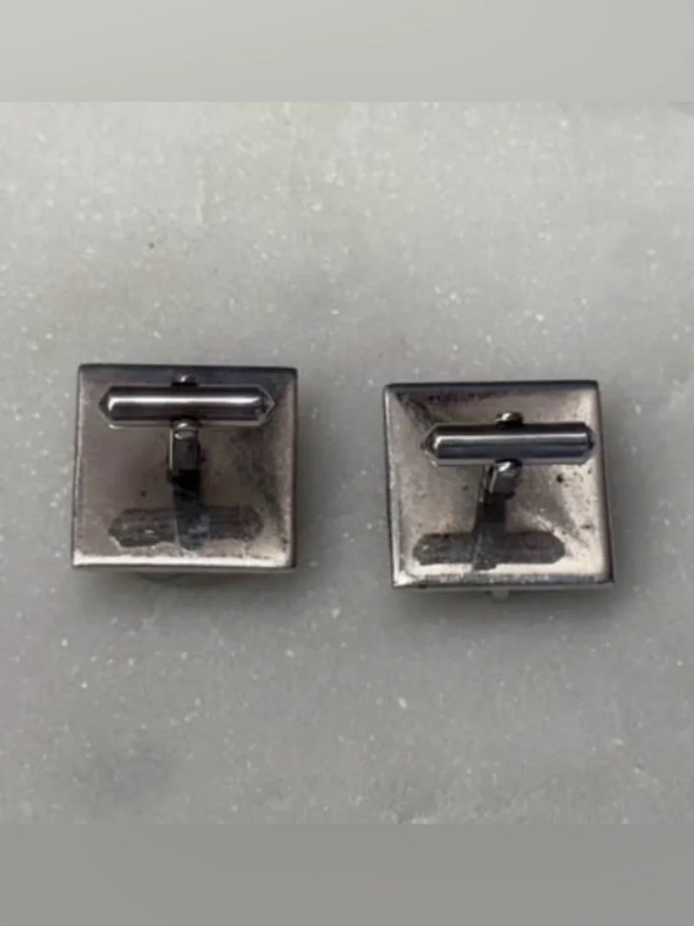 Vintage mid-century Destino cufflinks feature distinctive domed gray stones.